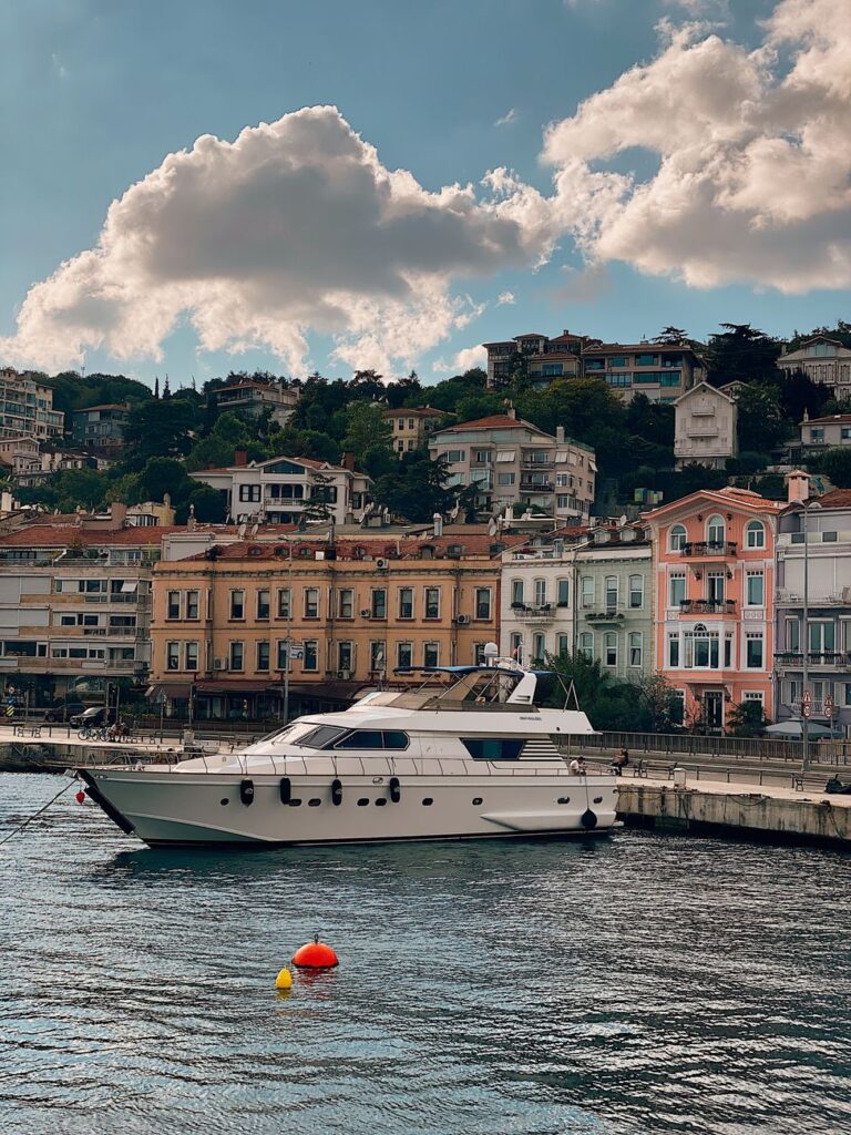 yacht docked near buildings